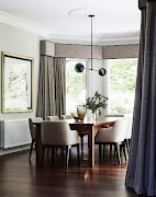 The formal dining room with upholstered Bryant dining chairs from Boyd Blue with wooden dining table and with pendant light from Douglas and Bec.