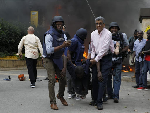 One of the injured being evacuated by security officers in 14 Riverside Drive, Westlands on Tuesday, January 15, 2019. /MONICA MWANGI