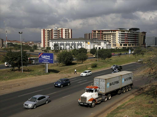 A truck joins the main Mombasa road from the Southern bypass road under construction next to the Nairobi National Park in Kenya's capital Nairobi, March 4, 2016. Kenya Wildlife Service (KWS) and the Ministry of Transport agreed to cut off about 53 acres of land from the Nairobi National Park to allow for completion of the 28 kms Nairobi Southern bypass road project. REUTERS