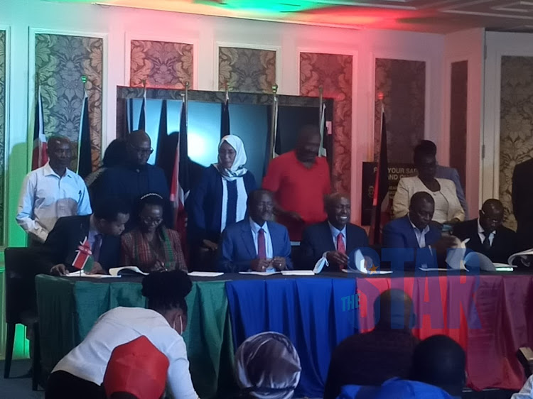 OKA principals; Martha Karua, Kalonzo Musyoka, Gideon Moi and Cyrus Jirongo sign a deal in Nairobi on March 11.