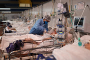 Nurse Fabiana de Oliveira works during the New Year at a field hospital set up at a sports gym to treat patients suffering from Covid-19 in Santo Andre, Sao Paulo state, Brazil on January 1 2021. 