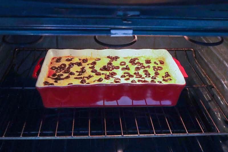 Sour Cream, Cheese, And Olives Added To The Casserole And Back Into The Oven.