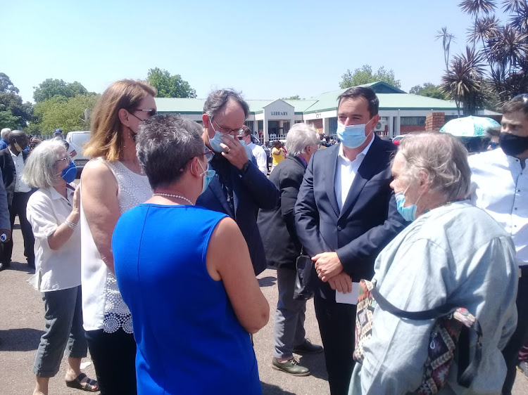 DA leader John Steenhuisen speaks to members outside the Howick community hall.