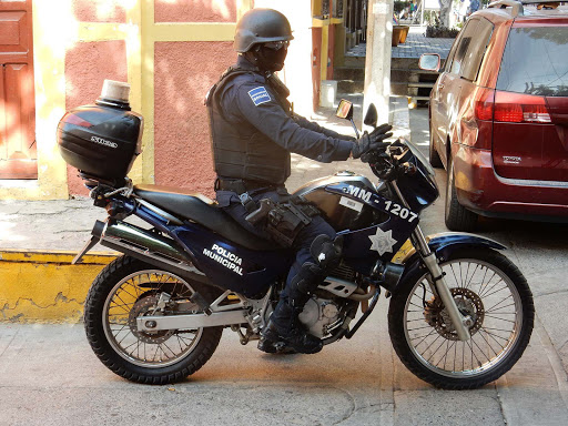 Policia-Municipal - A black-masked municipal policeman in Old Mazatlan caught passersby's attention. 