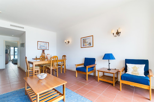 Buy this luxury apartment / penthouse in Albufeira (Portugal) - Living dining room with wooden furniture