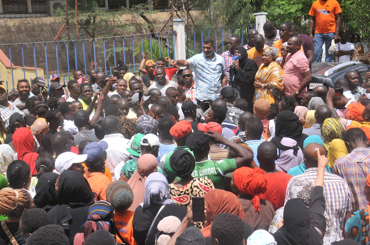 Mombasa governor candidate Abdulswamad Nassir with his supporters outside the Mombasa law courts on Monday