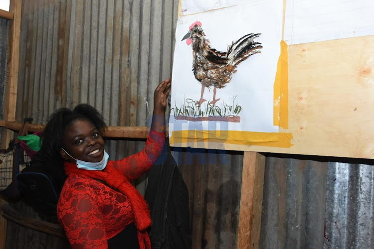 Praxedes Akoi, a grade 5 teacher, shows a final product after an interactive class session on 23 September 2021 through the new CBC curriculum. Recently the National Parents Association said that it will defend the embattled Competency-Based Curriculum in court after a case was filed to challenge it./ MERCY MUMO