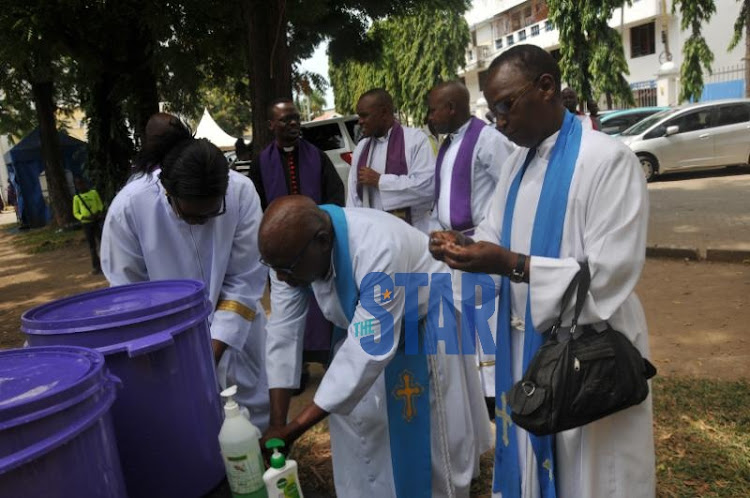 Bishops at ACK Mombasa memorial cathedral wash their hands on March 15, 2020.