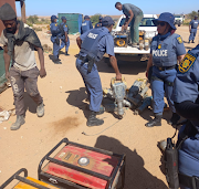 Some of the items police and SANDF members confiscated on Wednesday. Twenty-five suspected illegal miners were arrested.  