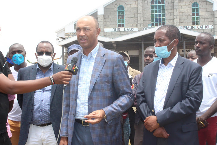 Former MP Peter Kenneth with MPs Peter Kimari (Mathioya) and Nduati Ngugi (Gatanga) at Kiria-ini Catholic church.