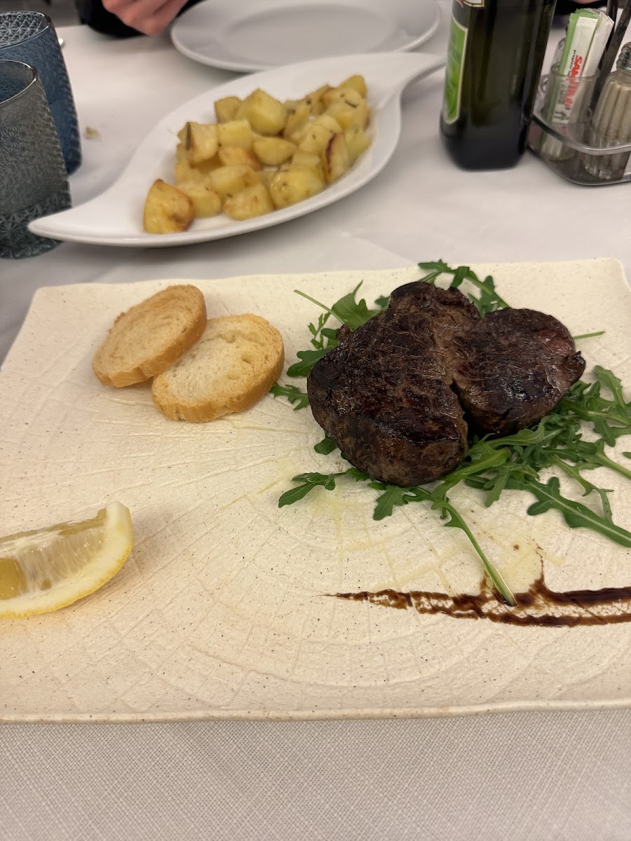 Steak and baked potato (bread is not GF)