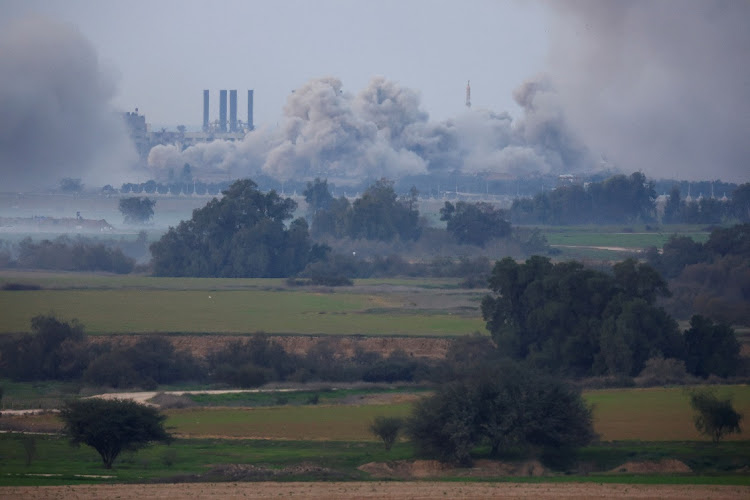 Smoke rises over Gaza, amid the ongoing conflict between Israel and the Palestinian Islamist group Hamas, as seen from southern Israel on December 30 2023.