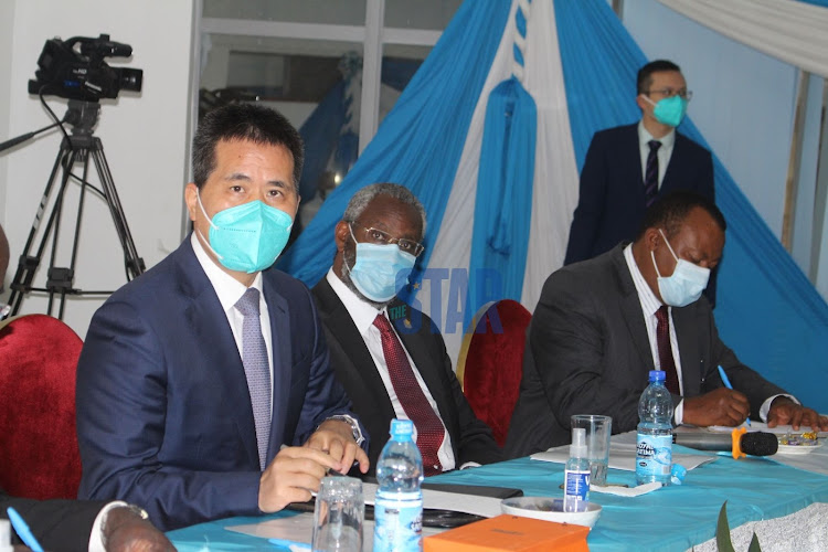 University of Nairobi vice chancellor Stephen Kiama, Ambassador, Embassy of the People's Republic of China in Kenya Zhou Pingjian interact during a seminar on the Centenary celebrations of the communist Party of China (CPC) at University of Nairobi, Kenya's capital Nairobi on June 16, 2021.