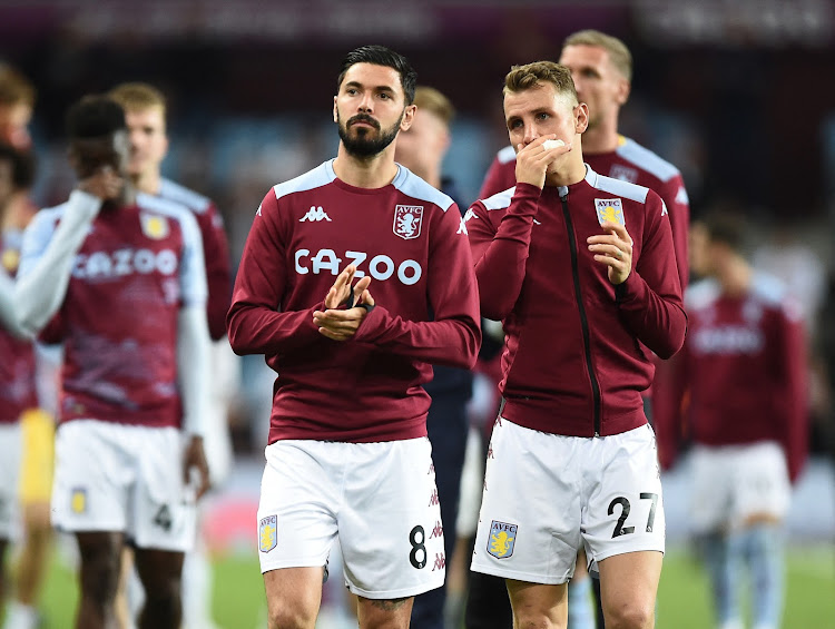 Aston Villa's Morgan Sanson with Lucas Digne after the match