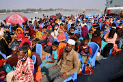 Rohingya refugees are seen aboard a ship as they are moved to Bhasan Char island in Chattogram, Bangladesh, December 4, 2020.
