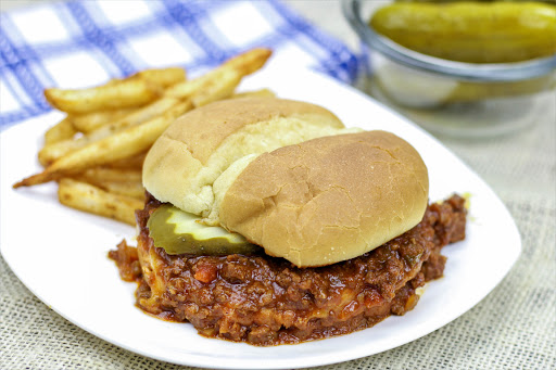 Sloppy Joe Mix on a toasted bun with a pickle.