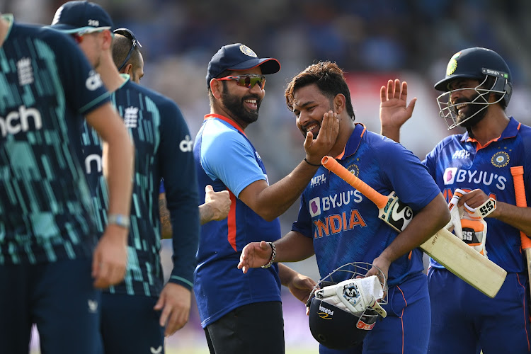 India batsman Rishabh Pant is congratulated by teammates after hitting the winning runs in the third Royal London Series One-Day International against England at Emirates Old Trafford on July 17, 2022 in Manchester