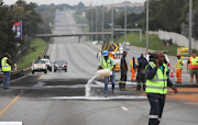 Authorities clean up the N1 after Friday's collision.