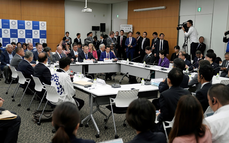 International Olympic Committee (IOC) delegation leader John Coates and Tokyo Governor Yuriko Koike attend the Four-Party Representative Meeting in Tokyo last year.