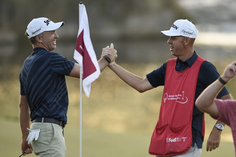 Martin Laird celebrate wit his caddy after winning the Shriners Hospitals for Children Open at TPC Summerlin in Las Vegas on October 11, 2020