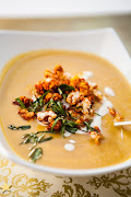 Indian-style curried butternut soup topped with spiced popcorn.