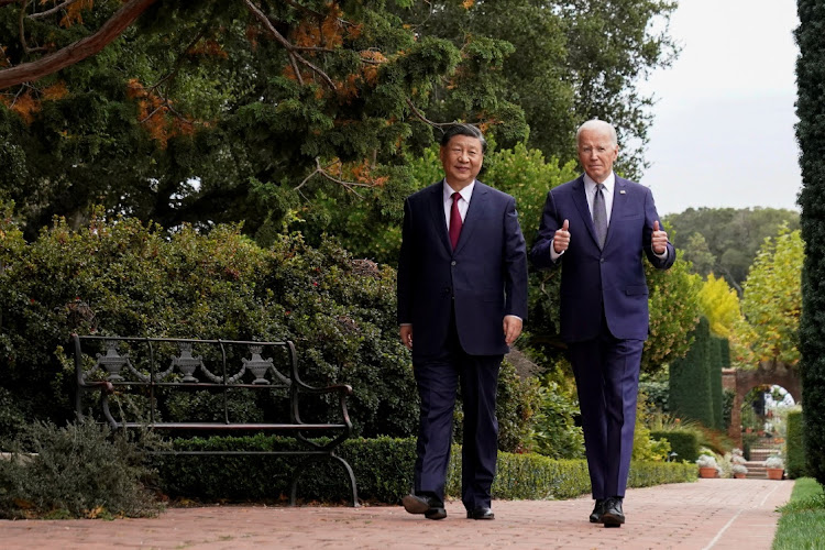 US President Joe Biden gives thumbs-up as he walks with Chinese President Xi Jinping at Filoli estate on the sidelines of the Asia-Pacific Economic Cooperation (APEC) summit, in Woodside, California, US, November 15, 2023.