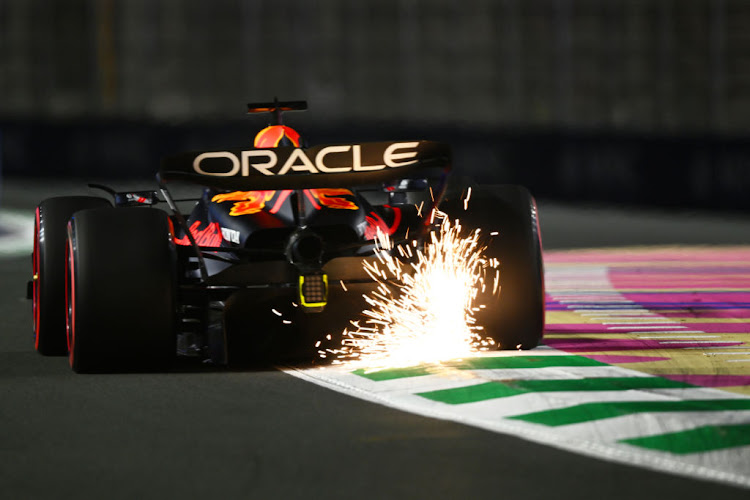 Sparks fly behind Max Verstappen during practice ahead of the F1 Grand Prix of Saudi Arabia at Jeddah Corniche Circuit on March 17, 2023 in Jeddah, Saudi Arabia.