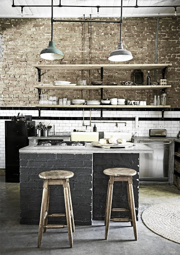 The concrete counters in the kitchen create a utilitarian and unpretentious tone.