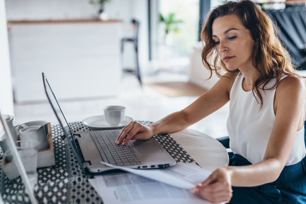 A Young businesswoman is working on official documents