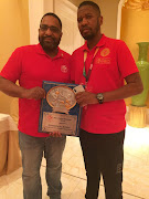 IBF president Darryl Peoples, left, presents his organisation’s promoter of the year award on the African continent to Rumble Africa boss Thembalethu Ntuthu.