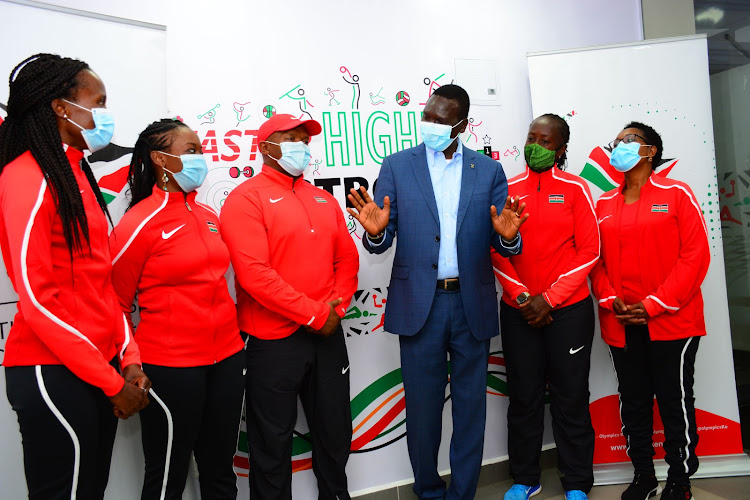 NOC-K president Paul Tergat with the Team Kenya's technical support staff of (L to R) : Dr. Carole Okoth, Kanyali Ilako, Geoffrey Kimani, Rosemary Owino and Mercy Barwecho during their unveiling at NOC-K offices