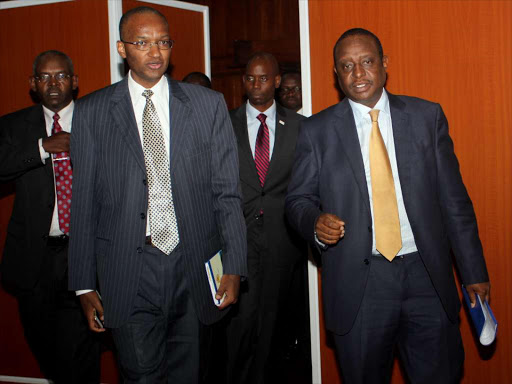 Central Bank Governor Patrick Njoroge with Treasury Cs Henry Rotich during the State of Banking sector address in Nairobi's Kenyatta Conference Center on April 8. Photo/Enos Teche.