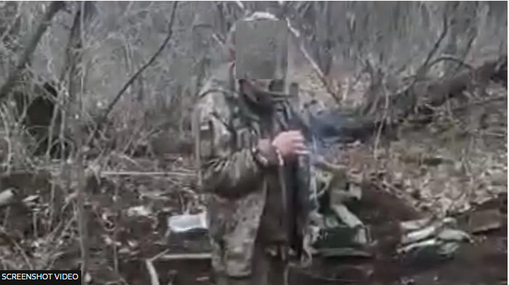 A screenshot from the video purportedly showing the Ukrainian prisoner of war before he was shot dead