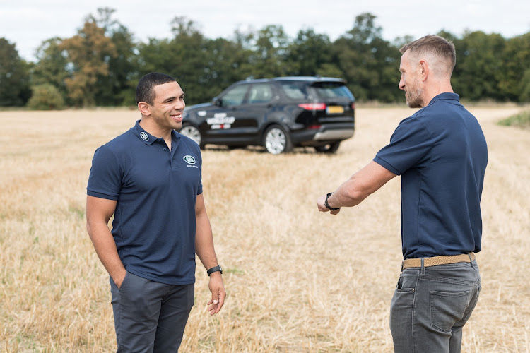 Land Rover ambassadors Bryan Habana (L) and Will Greenwood (R) chat during an event for Rugby World Cup 2019.