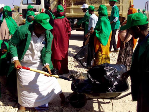 Civil servants and residents taking part in the clean up in Wajir on Saturday.Photo Ismail Noor