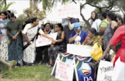 ANGER: Phoenix residents protest outside Mahatma Gandhi Memorial Hospital over poor conditions and the alleged deaths of babies at the institution. Pic:  MHLABA MEMELA. 09/11/2009. © Sowetan.