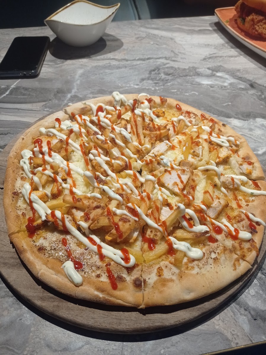 GF pizza with spicy chicken and skinny chips