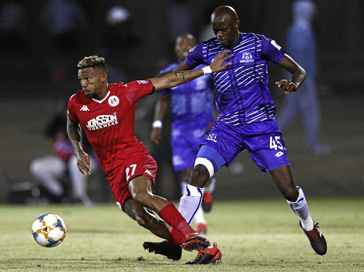 Wayde Jooste of Highlands Park gets the better of Kwanda Mngonyama of Maritzburg United during their Absa Premiership match on Friday.