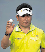 Gonzalo Fernandez-Castano of Spain watches his shot during the third day of the Singapore Open at the Tanjong Course on Sentosa Island yesterday. The Spaniard stormed into a three-shot lead before a tropical downpour in the afternoon forced organisers to abandon play and reduce the event to 54 holes Picture: REUTERS