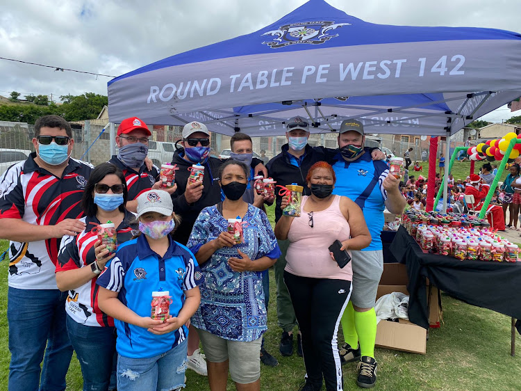 Helping to make the Helenvale Christmas party possible are volunteers, back from left, Jean-Pierre du Plessis, Pienaar Allers, Schalk Rossouw, Callie Steenkamp, Cornel Strydom and Dewald Niemand. Front: Carmen Johannie, Zoe du Plessis, Roos Pullen, and organiser Rina Potgieter