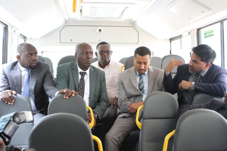 Transport CS Kipchumba Murkomen (left), PS Joseph Mbugua (Roads) Mohamed Daghar (Transport) and CEO Basi Go Jit bhattacharya during the launch of e-buses on April 12, 2023.