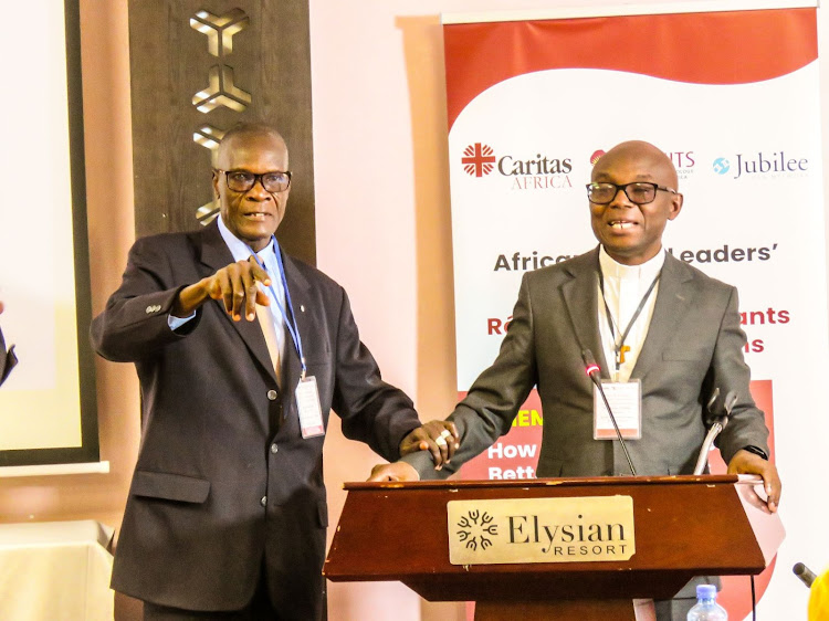 CARITAS Africa campaigns Manager Sam Zan Akologo with Fr. Charles F. Chilufya S. J during the African Faith Leaders press briefing at a Nairobi hotel on August 8, 2023.