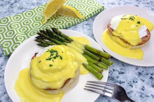 Classic Hollandaise drizzled over poached eggs and asparagus.