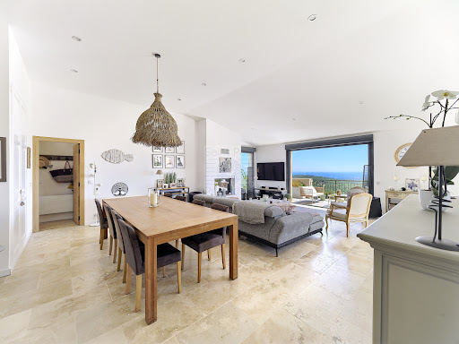 Bright dining room and living room sea view in this luxury house for sale in Tourrettes-sur-Loup ($1,879,464 - 223 m²)