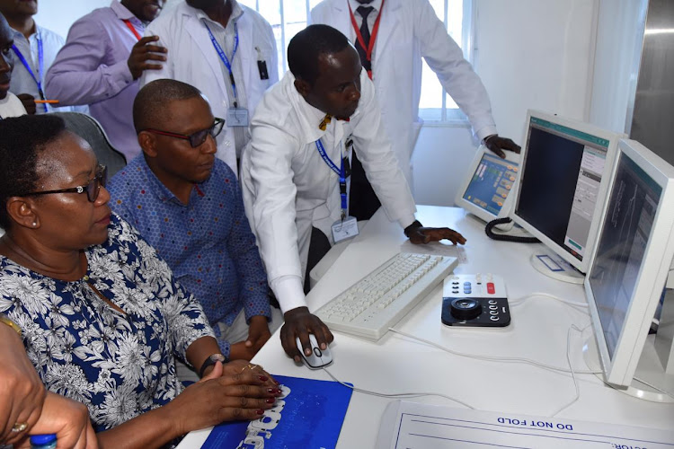 Health CS Sicily Kariuki and medical staff at the CT Scan centre in Coast General Teaching and Referral Hospital on Saturday