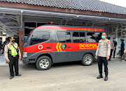 A police vehicle is seen outside Tangerang Hospital, where the remains of people killed in a fire at Tangerang Prison are kept, in Banten province, Indonesia, September 8, 2021. 