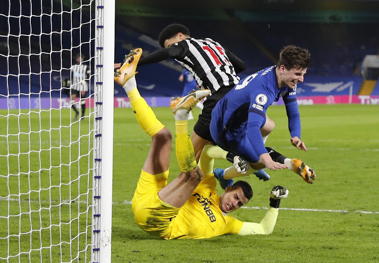 Chelsea's Mason Mount in action with Newcastle United's Karl Darlow and Jamal Lewis