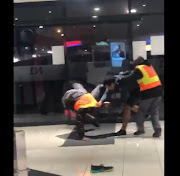 In a viral video, the man is seen getting into a physical altercation with three security guards at the mall. 