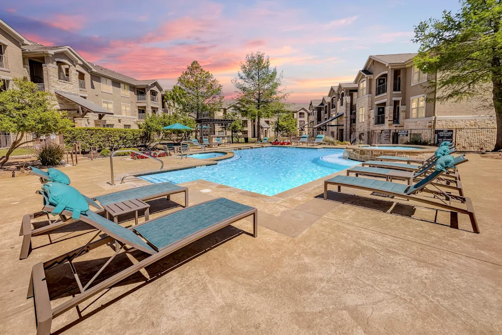 Dry Creek Ranch Apartments resort-style swimming pool at dusk