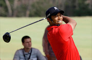 U.S. golfer Tiger Woods participates in a golf teaching clinic for South Korean juniors during a Nike Golf 